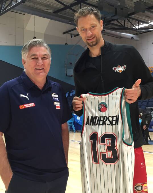 REUNITED: Ballarat Miners coach Brendan Joyce presents Australian basketball star David Andersen with his NBL jersey from his rookie season. Picture: Kyle Evans