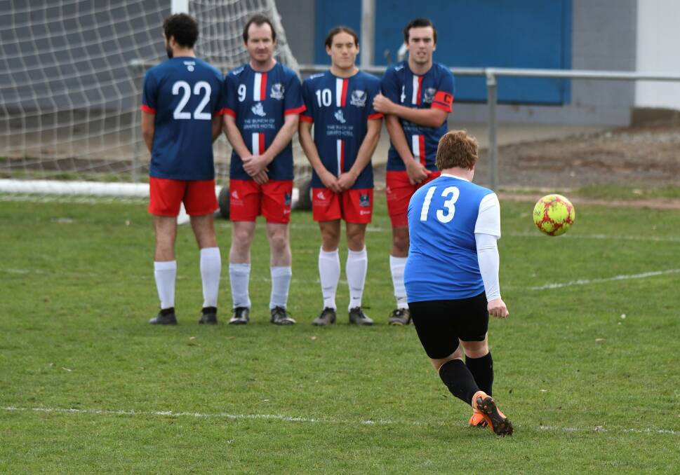 BEND IT: Riley Gardam of Maryborough takes a penalty shot during the 2019 BDSA division one open season. Picture: Lachlan Bence