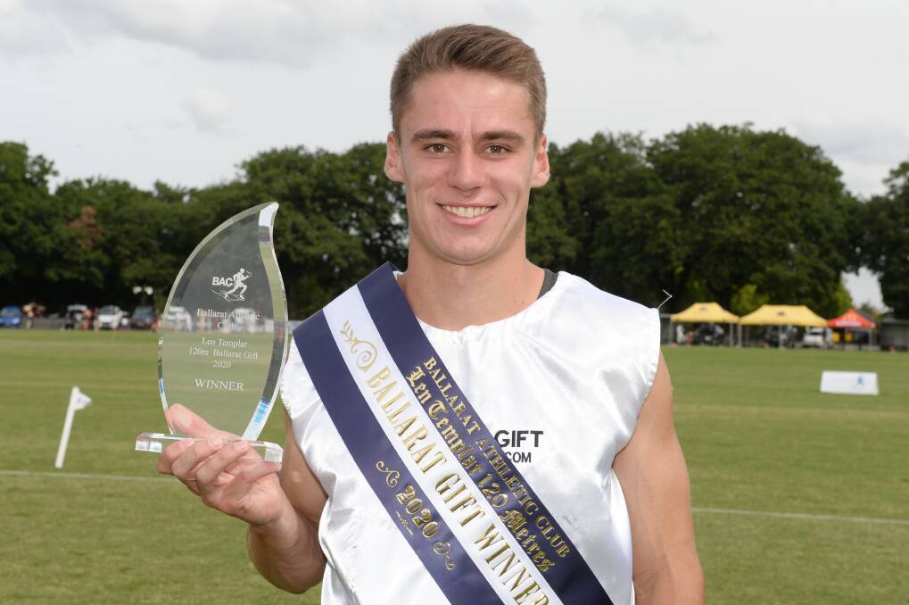 GOLD: Michael Hanna poses for the cameras after winning the 120-metre men's Gift final on Sunday. Picture: Kate Healy
