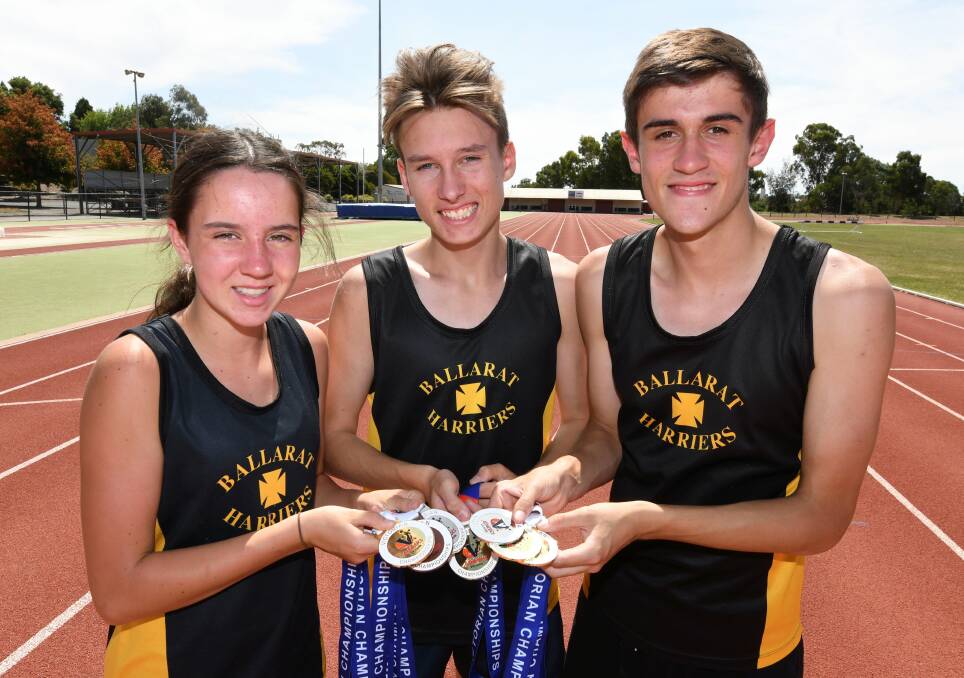 CLEANING UP: Chloe Kinnersly, Cooper Sherman and Matthew O'Brien of Harriets Athletics Club all won gold medals at the Victorian Country Championships. Picture: Lachlan Bence