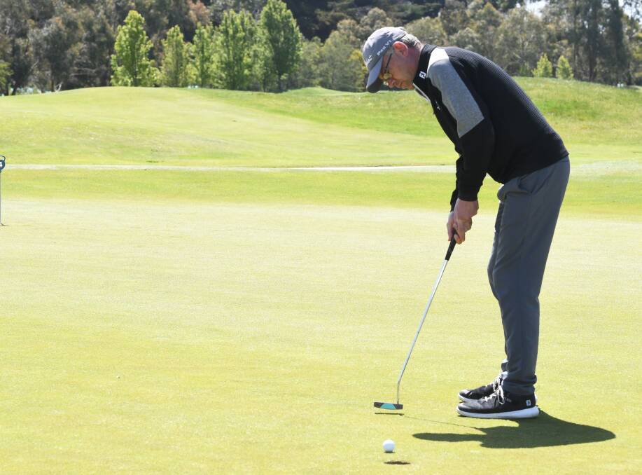 Tatt works on his putting ahead of the $60,000 PGA National Futures. Picture: Lachlan Bence.