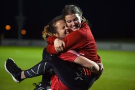PURE JOY: Ballarat captain Lucy Brennan celebrates with sister Meg Brennan after winning the BDSA division one open women's grand final. Picture: Kate Healy