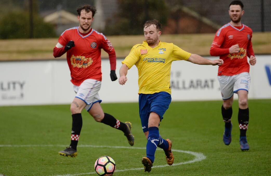 Sebastopol's Ryan Williams outpaces Liam Newman in his side's loss to Strathmore. Picture: Kate Healy