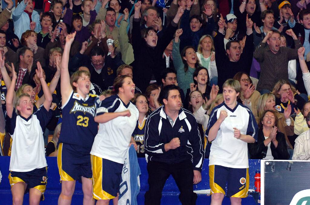 VICTORY: The lady Miners' bench erupts as time expires after edging out a one-point win in the 2005 SEABL grand final.