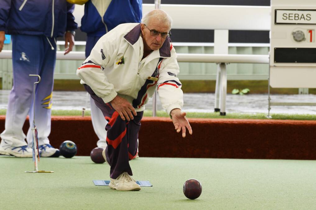 MORE RAIN: Central Wendouree's Len Vincent bowls down the green in his side's clash with Sebastopol. Picture: Kate Healy 