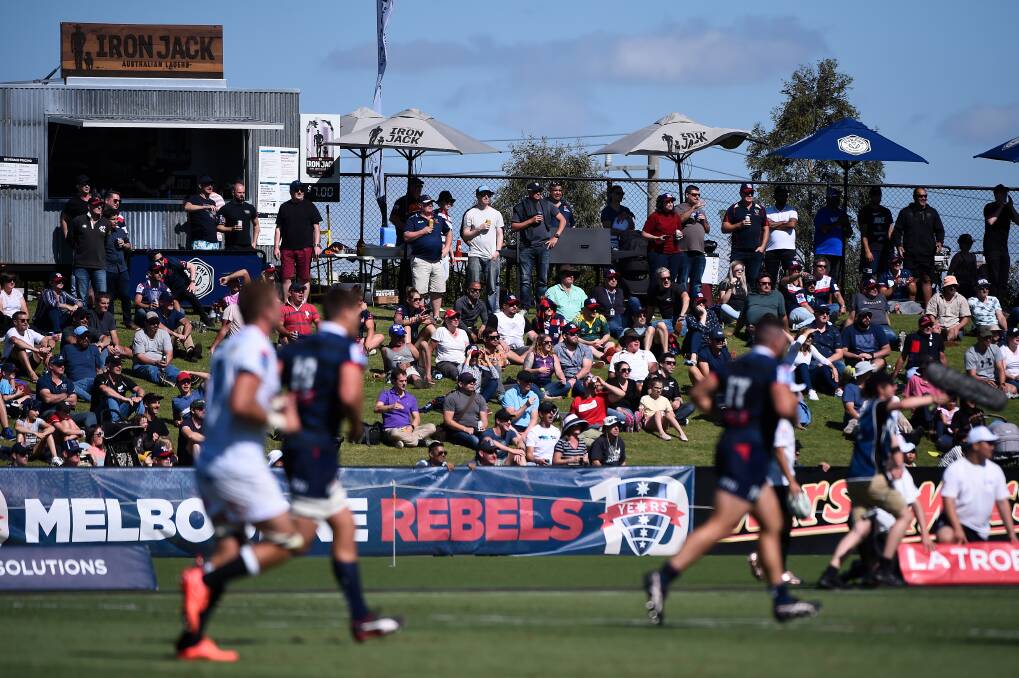 WATCHING ON: Fans pack the Mars Stadium hillside to watch the Melbourne Rebels do battle with the Sharks.
