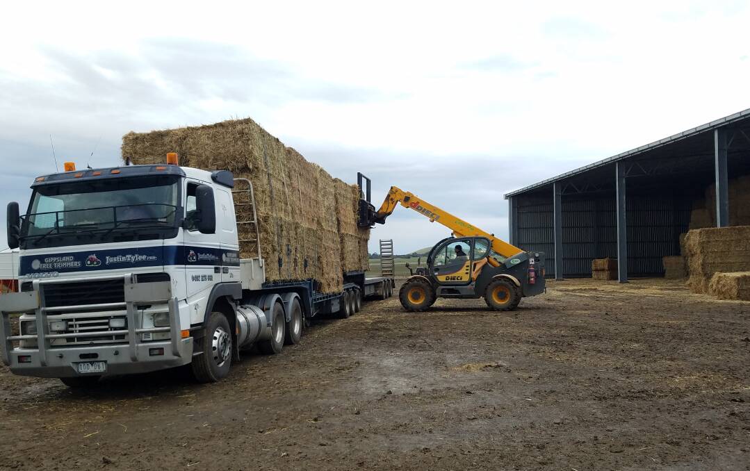 GOLD HAUL: A truck is loaded with hay that is becoming increasingly valuable. Photo: Leanne Younes