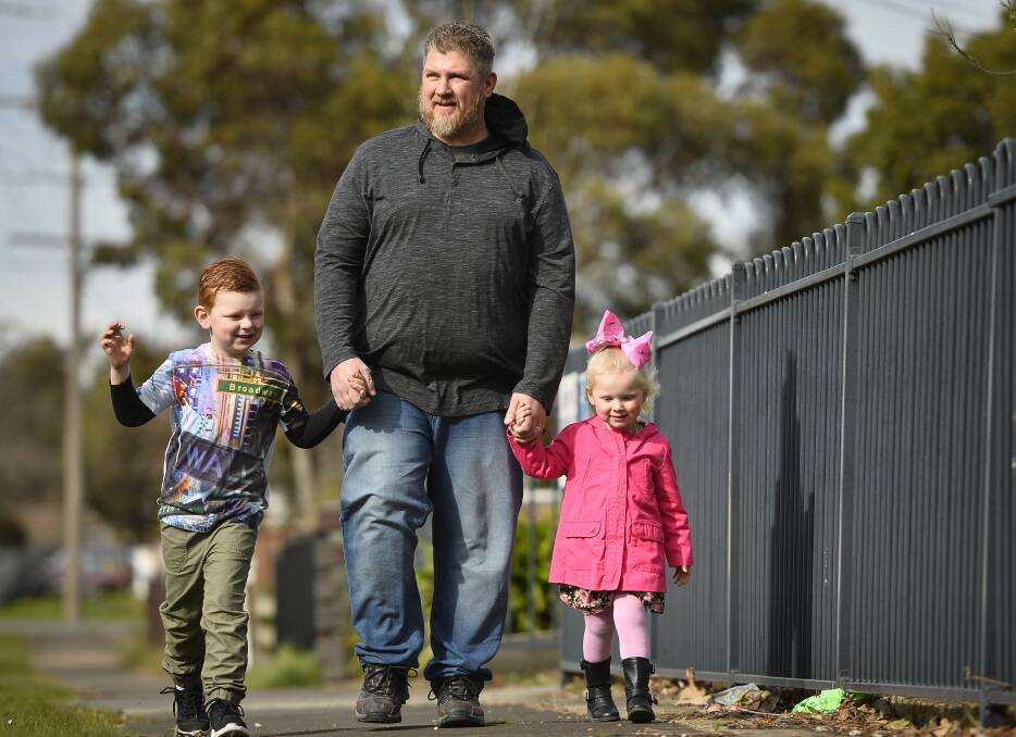 PEER SUPPORT: Devoted dad Leigh Whitten heads to the Me and My Dad play group with children, Jaxon and Tori. Picture: Dylan Burns 