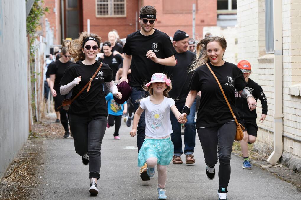 DASHING: Sophie Davies and Alex Bowen, Jasmine Kelava, 6, and Emma Boag, from Ballarat lead the first heat in the 600m Hopathon dash around the block on Saturday to raise money for Ballarat Hospital's Special Care Nursery. Picture: Kate Healy