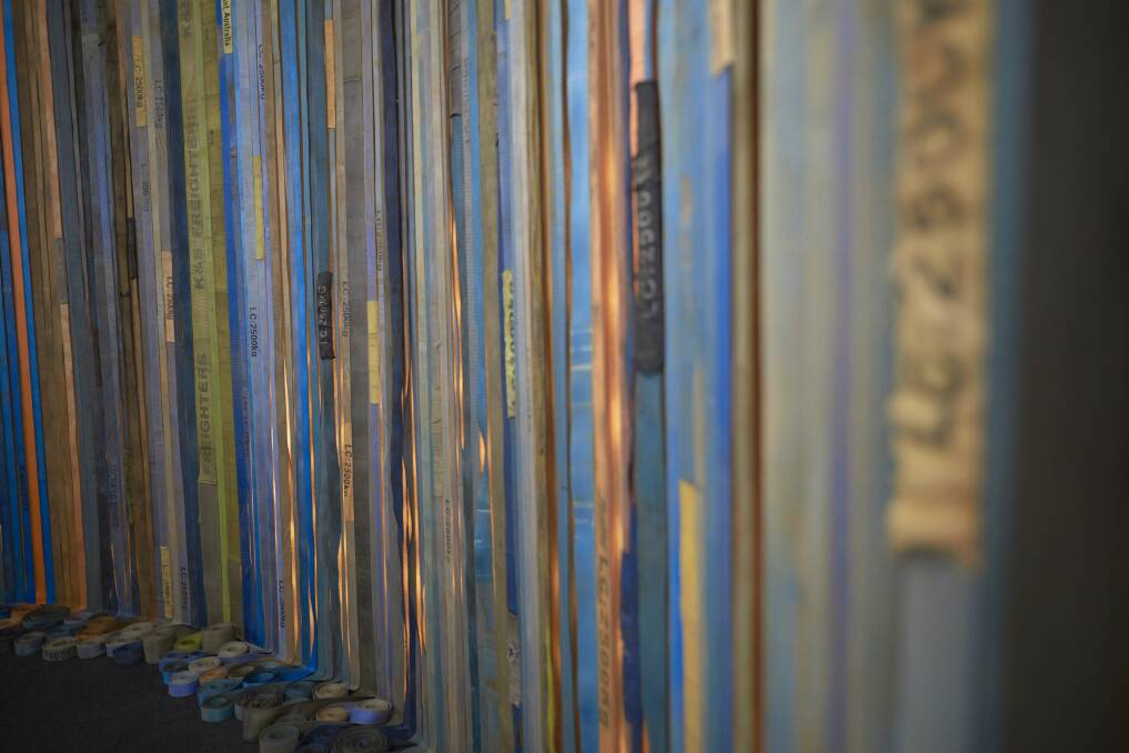 TRIBUTE: Truck tie downs have been collected and hung to form a colourful display. Photo: Luka Kauzlaric