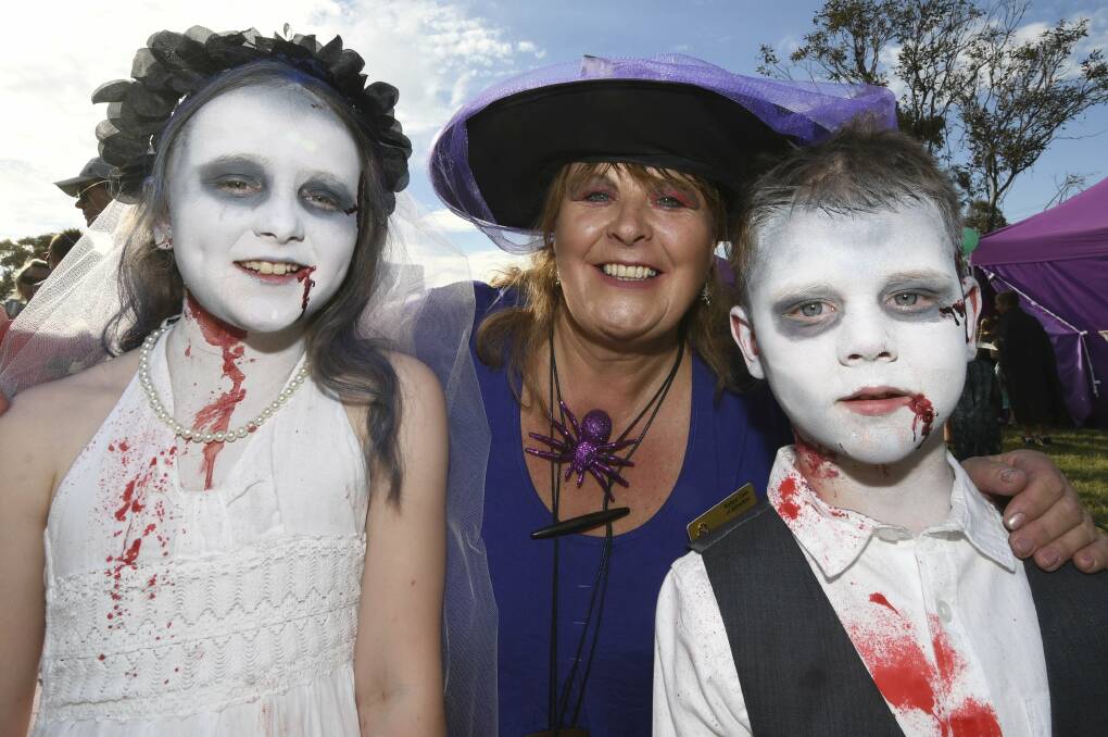 Ready for Halloween: Nine year old Zoey Jew, Alfredton Rotary event co-ordinator Kathy Rivett, and Riley Jew, 6. Photo: Lachlan Bence