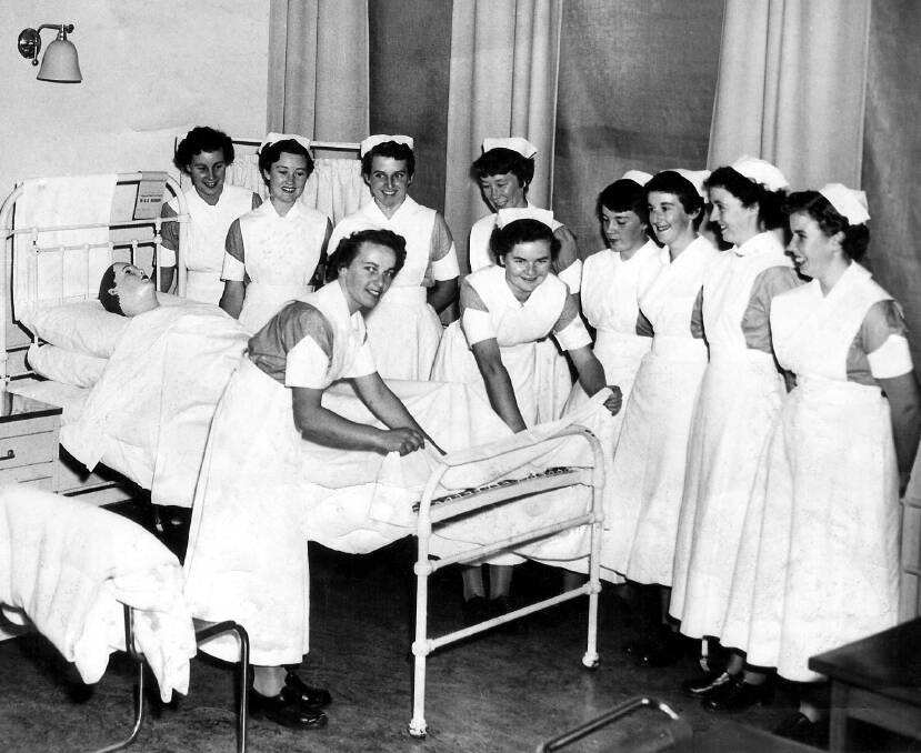 Class of 1954 - Nurses learn as bedmaking group 