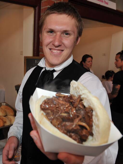 Tasty treat: Jake Romein from Sovereign Hill was kept busy during service at Friday night's Family Hawkers Market - the launch of Good Food Festival. Picture: Lachlan Bence