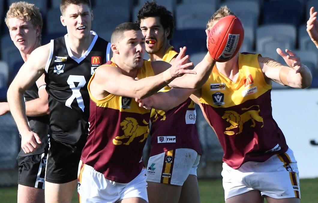Redan new face Shaun Grigg finds the ball against North Ballarat City. Pictures: Lachlan Bencel 