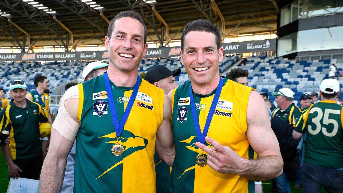 Mark Gunnell, left, with his twin brother Luke after Gordon's 2023 CHFL premiership victory. Picture by Adam Trafford.