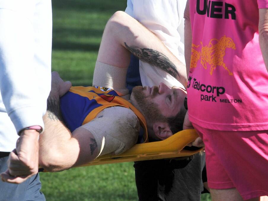 Vibrant Sebastopol forward Michael Powell is stretchered off the ground as the realisation sinks in that an ankle injury has almost certainly ended his finals campaign after less than two quarters. Picture: Lachlan Bence
