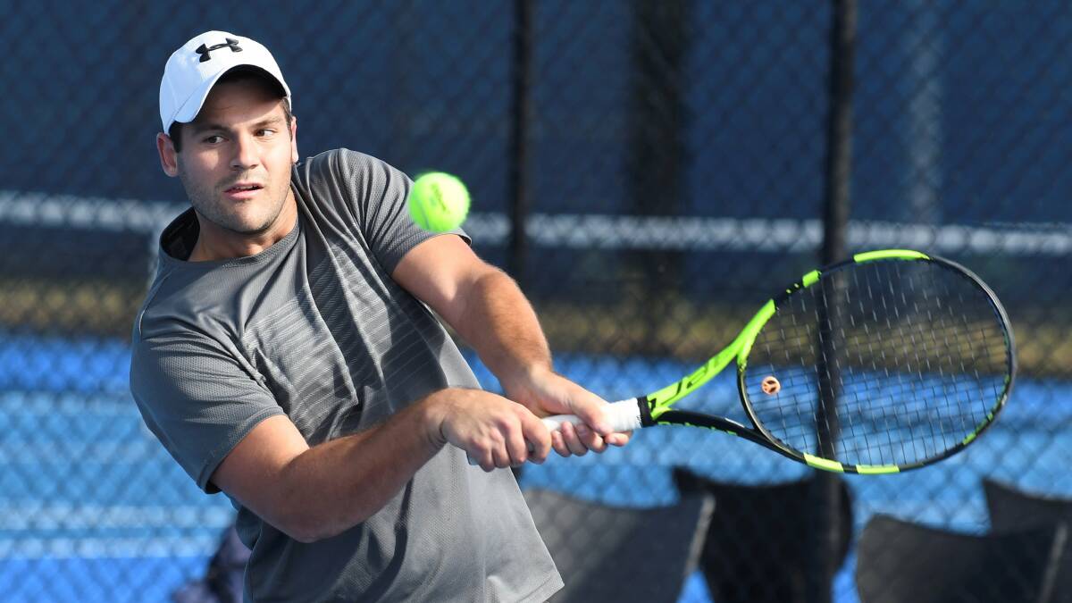 EARLY EXIT: South African Ryan Laubser powers through a backhand in a Ballarat Open Platinum AMT qualifying match on Tuesday. He lost to Marlino Pascual in straight sets. Picture: Lachlan Bence 
