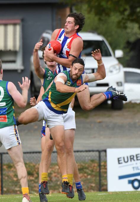 SCREAMER: Jacob Brown gets a taste of high altitude has he flies over Lake Wendouree defender Sam Clifton. Picture: Lachlan Bence