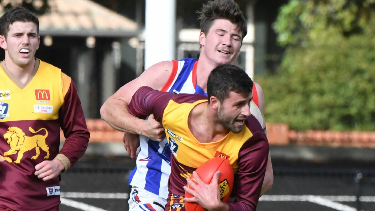 Nathan Horbury in a tangle with fellow BFL representative Matt Johnston on Saturday.