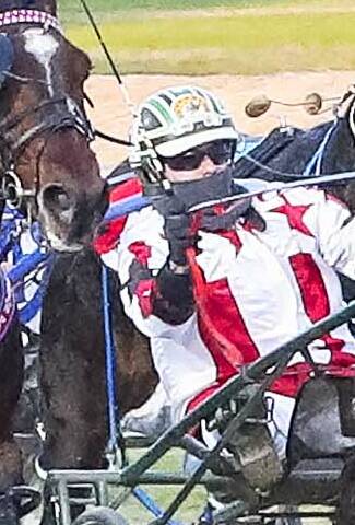 FLYING: Emerging harness racing driver Darby McGuigan rugged up against the cold. Picture: Stuart McCormick, HRV