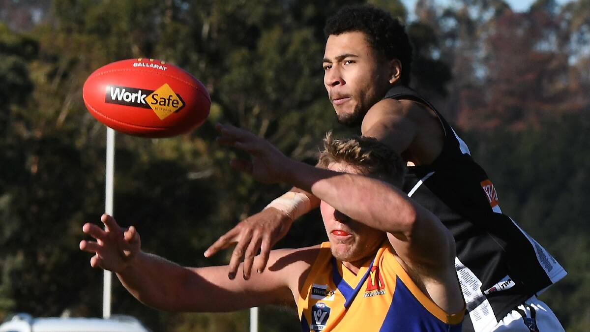 Darley's Khyle Ford gets over the top Sebastopol ruckman Toby Thoolen. Picture: Lachlan bence