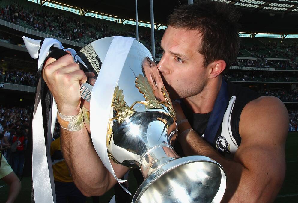 HIGHLIGHT: Nathan Brown with Collingwood's 2010 AFL premiership cup - a special moment in his playing career. Picture: Getty Images