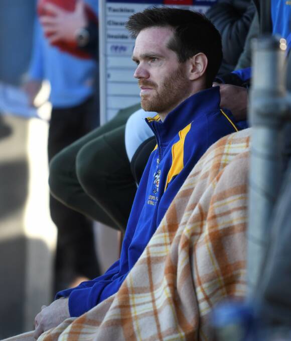 A forlorn Michael Powell watches on from Sebastopol's bench at the Eastern Oval on Saturday after injuring his right ankle.