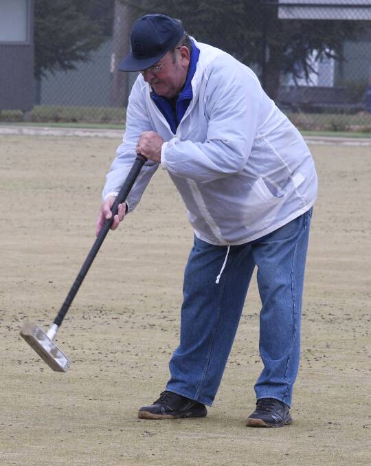 OUT AND ABOUT: Bob David gets back in the swing with the mallet at Alexandra Croquet Club. Picture Lachlan Bence.