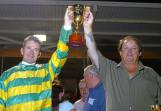 Peter Tonkin and reinsman Gavin Lang celebrate their Ballarat Pacing Cup win witn Robin Hood. Picture by Jeremy Bannister.