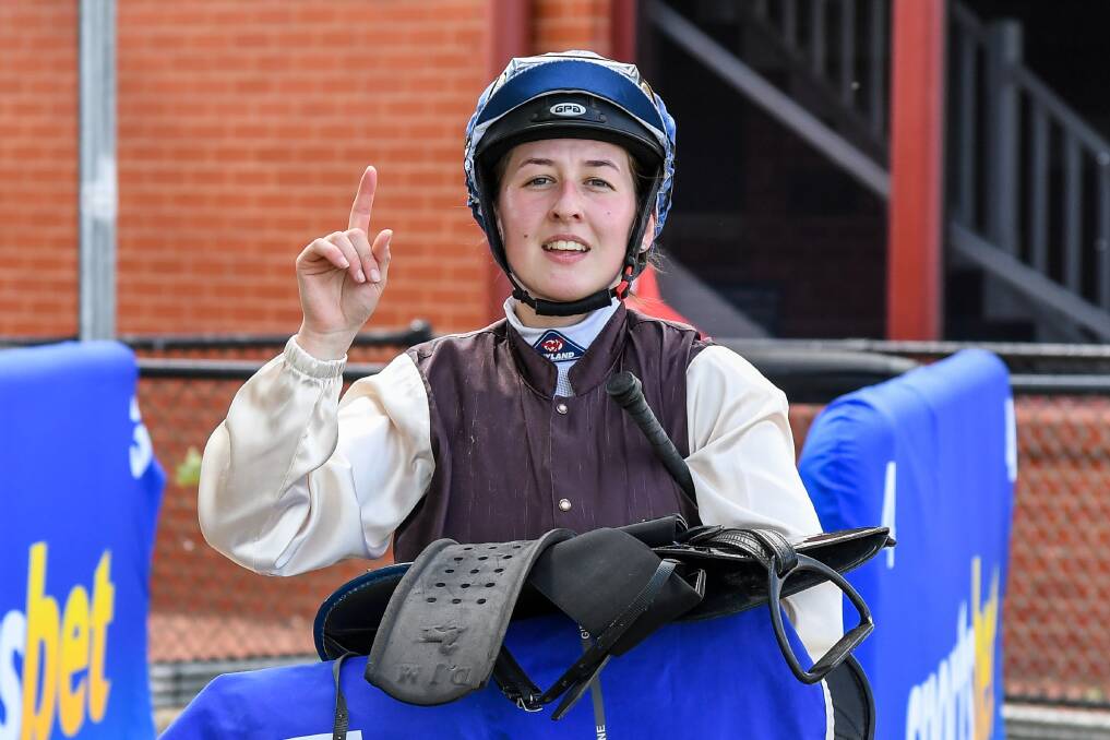 WINNING WAY: Alana Kelly gives a victory salute after winning at Wangaratta on Wednesday as part of a big week. Picture: Racing Photos