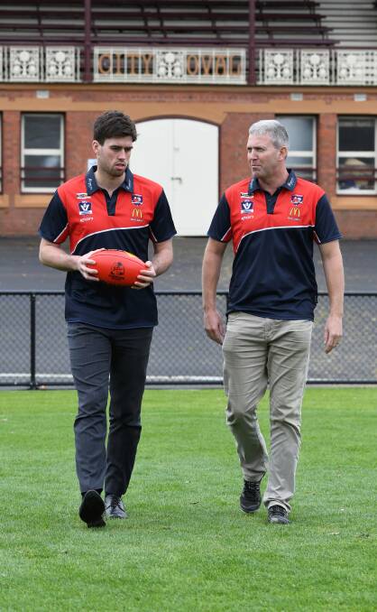 PRE-GAME TALK: BFL coach Shaun O'Loughlin, right, chats with Tony Lockyer at the City Oval. Picture: Lachlan Bence