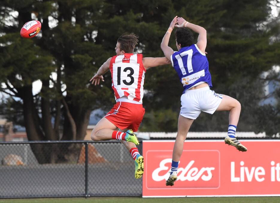 Tyler Constable (Ballarat) and Jack Hannett (Sunbury) provide a touch of synchronism at Alfredton.  Picture Lachlan Bence.