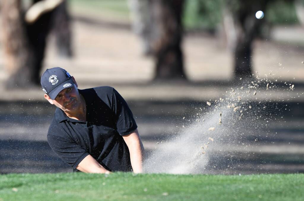 SAND TRAP: Ross Titheridge blasts his way out of a bunker at Midlands. Picture: Lachlan Bence
