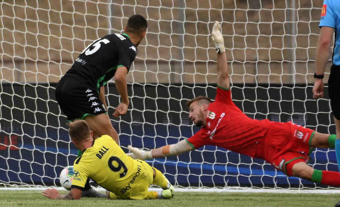 BEATEN: Wellington's David Ball opens the scoring as he puts a shot past the out-stretched arm Western United goalkeeper Filip Kurto.