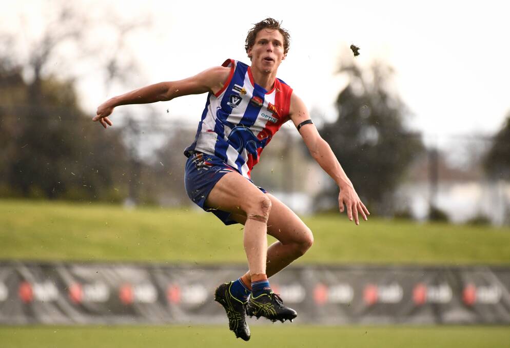Jake McQueen gets a kick away without a spectator in sight. This could be a sign of things to come if the BFL gets a competition off the ground this year.