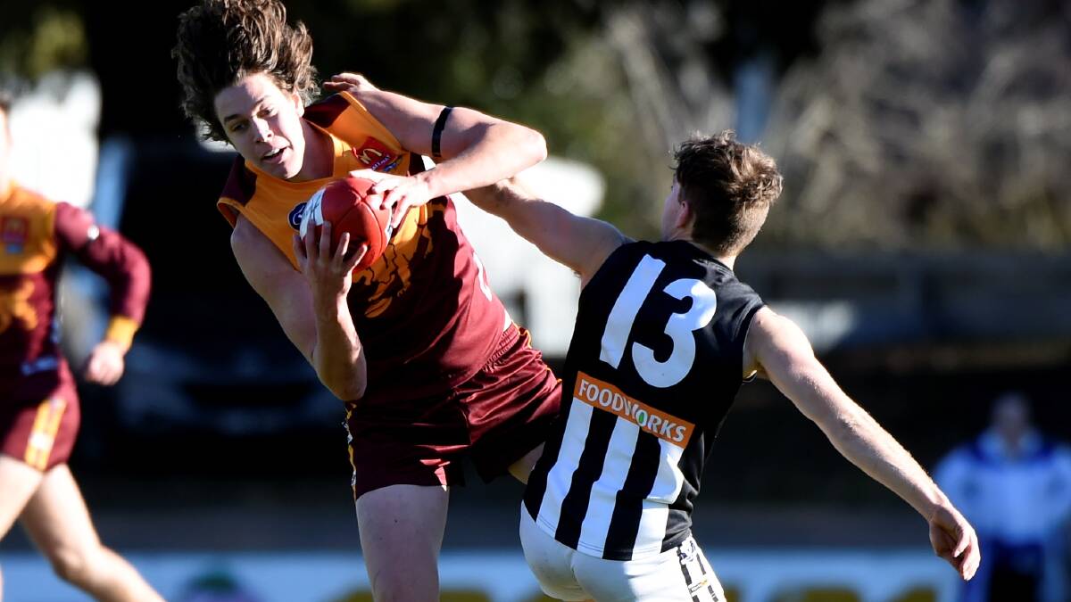 
Ben Smyth (Redan)  out-marks Harley Inglis (Darley) at the City Oval. Picture: Lachlan Bence