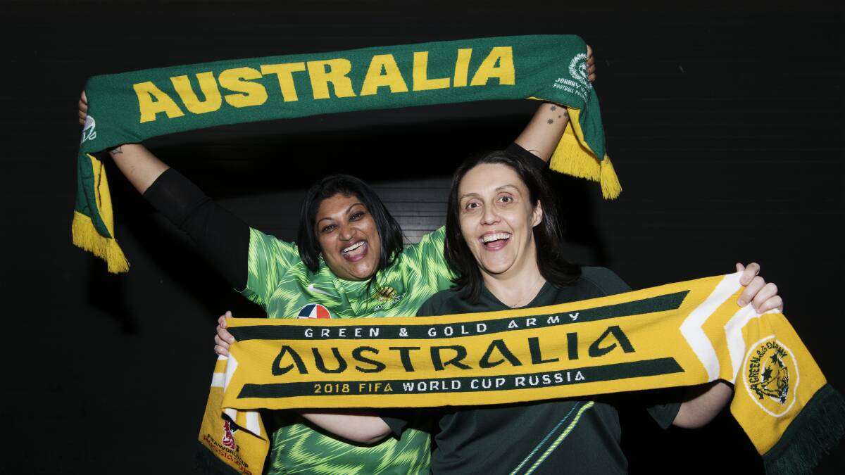 GREEN AND GOLD: Michelle Prasad and Carla D’Alessandro are among the thousands of Socceroos fans bound for Russia. Picture: James Brickwood