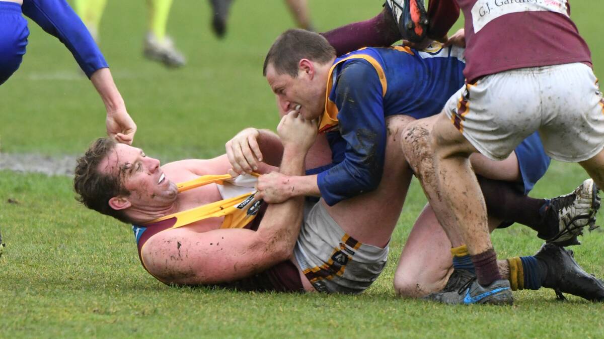 Redan ruckman Orren Stephenson and Sebastopol's Laxchie Cassidy get in a tangle on the deck. Picture: Lachlan Bence 