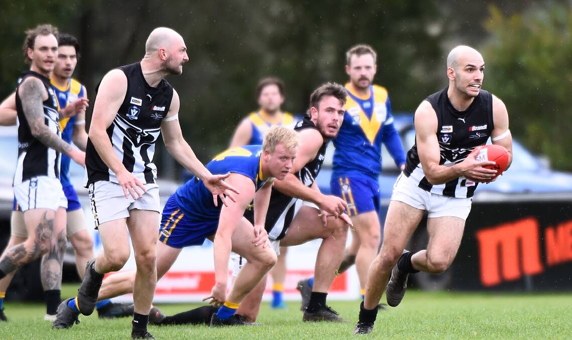 Damian Fazio gets Clunes on the move against Learmonth at Learmonth on Saturday. Picture by Adam Trafford.
