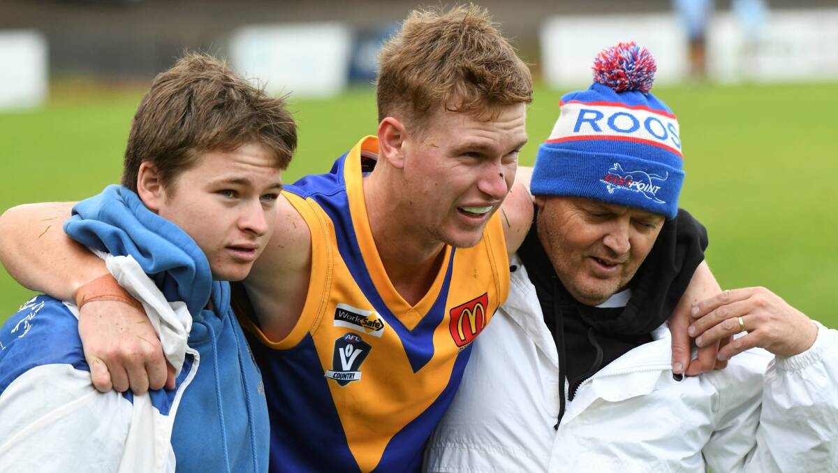 Toby Hutt is helped off the field after breaking a leg early in the season. He is back for Sebastopol to face Bacchus Marsh on Saturday.