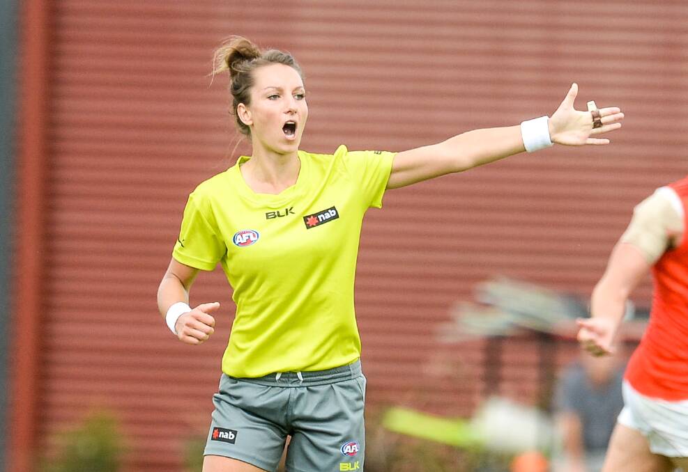GOOD CALL: AFL's first female central umpire Eleni Glouftsis is a positive example of the fast-evolving landscape in Australian Rules. Changing accepted behaviour standards, on and off the field, comes back to all of us. Picture: AAP