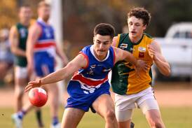 Daylesford's Adam Pasahidis leads Dylan Anderson (Gordon) to the ball at Daylesford on Saturday. Picture by Adam Trafford.