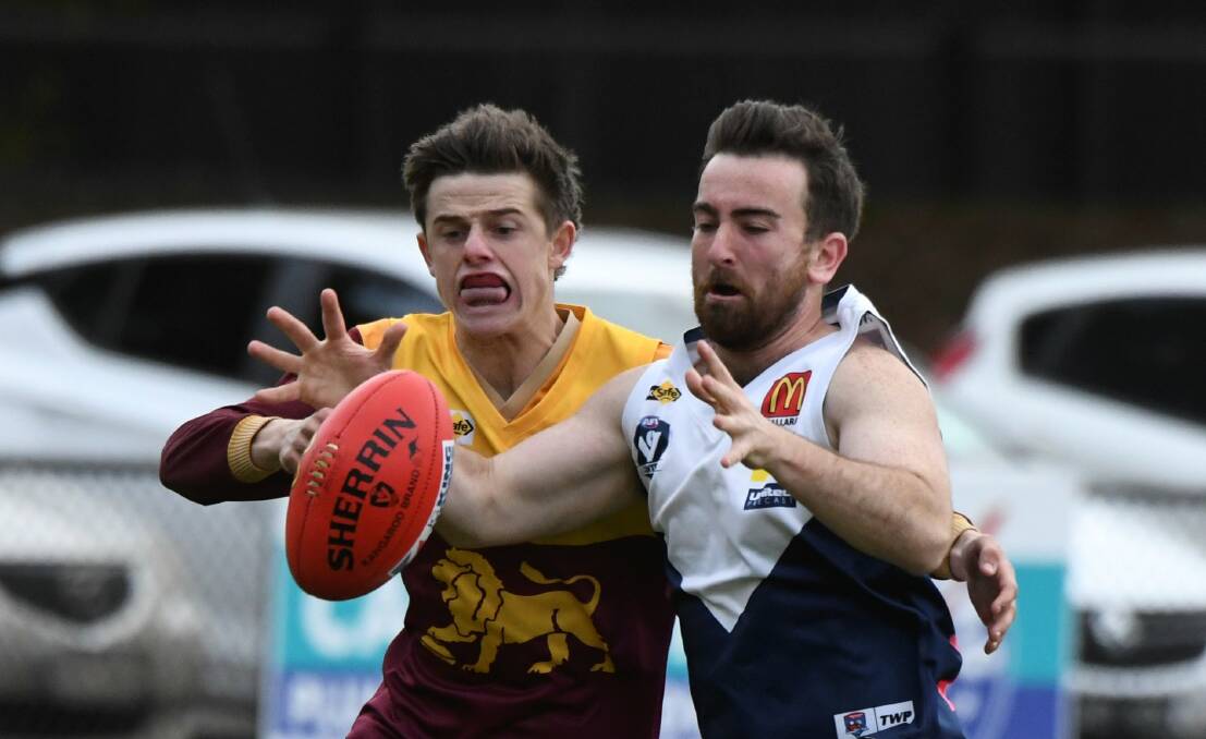 Liam Phillips (Redan) and Rhys Souter (Melton South) go at it at the City Oval. Picture: Lachlan Bence