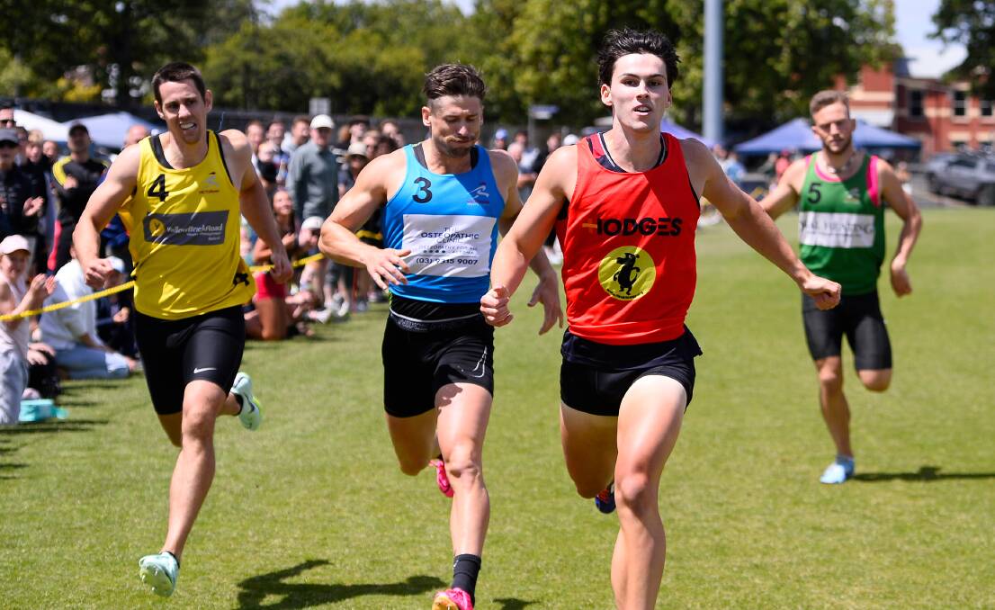 Elijah Cross hits the line ahead of Lincoln Barnes in the open 400m at the Ballarat City Oval on Sunday. Picture by Adam Trafford.