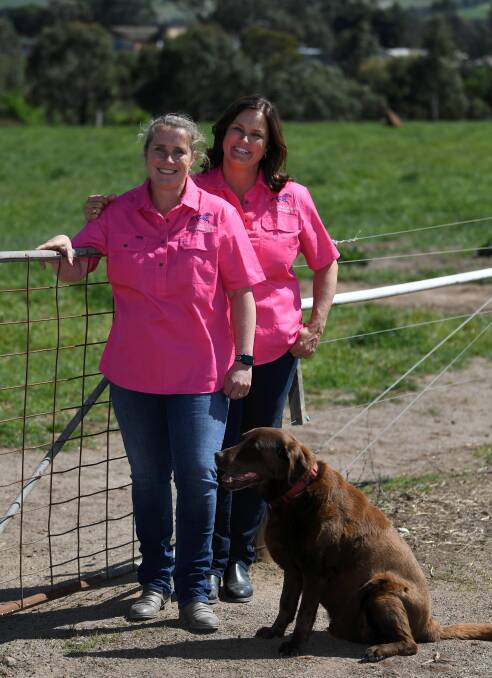 Sisters Anita Frawley and Kelly Amoore with Jimmy in front of a luck agistment paddock.