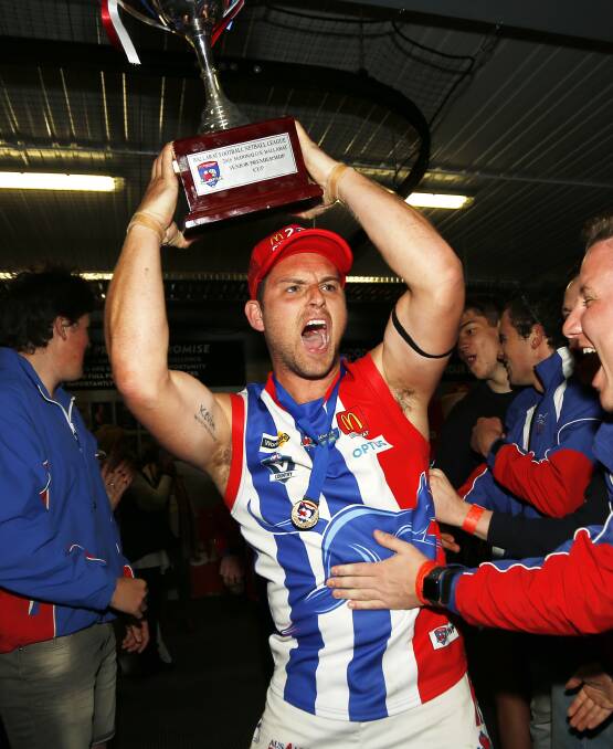 HIGHEST OF HIGHS: Daniel Tung finally gets his hands on a BFL premiership cup after a senior career with East Point spanning almost a decade. Picture: Dylan Burns