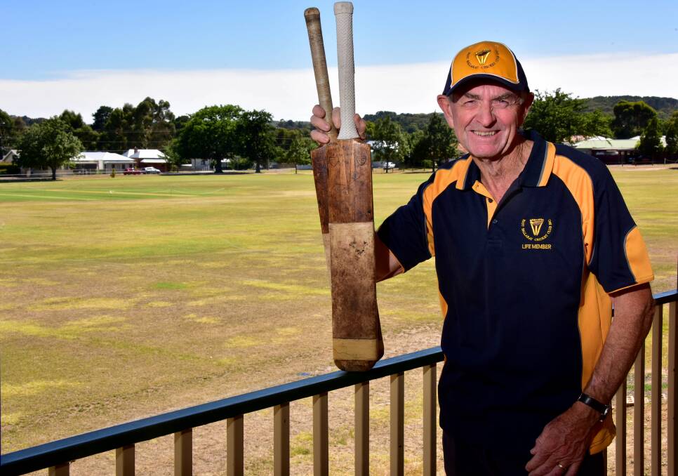 Mark Ryan with two bats from East Ballarat's first junior kit bag of 40 years ago. Picture: Brenan McCarthy