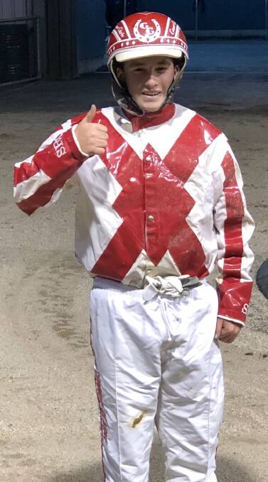 BREAKTHROUGH: Connor Clarke, wearing his family racing colours, gives the thumbs up after having his first winning drive.