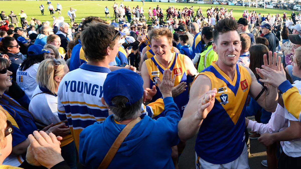 THRILLED: Dayne Furness, a late inclusion for Sebastopol, leads players through a throng of fans into the rooms.