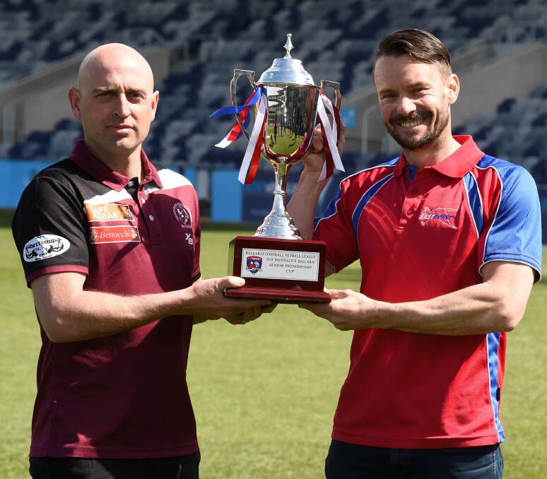 UP FOR GRABS: Melton coach Aaron Tymms and East Point counterpart Jake Bridges are hoping to have their hands on this piece of silverware at the end of the day. Picture: Lachlan Bence